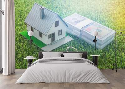 House model, bill dollar banknotes and key on green artificial grass background. Money saving for new house, home loan, reverse mortgage and real estate property business concept Wall mural