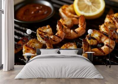 A close-up of perfectly grilled shrimp on a sizzling barbecue, glistening with marinade, and served with a slice of lemon and dipping sauce, showcasing mouthwatering details Wall mural