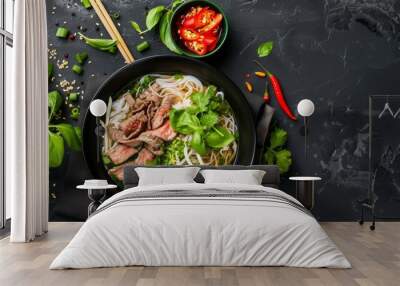 A delicious bowl of Vietnamese pho, with thinly sliced beef, fresh herbs, bean sprouts, and lime wedges, served hot and steaming Wall mural