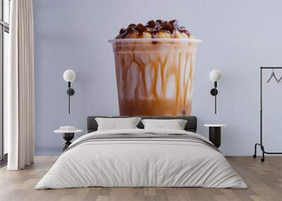 A refreshing cup of bubble tea with a layer of creamy milk tea and a generous amount of chewy tapioca pearls, positioned on a plain white surface. Wall mural