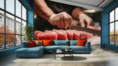 A sushi chef carefully slicing a whole tuna fish into sashimi-grade portions, showcasing the precise technique required for preparing high-quality seafood Wall mural