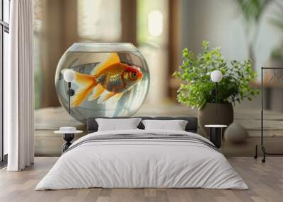 Goldfish bowl on a wooden table with a decorative plant, creating a serene home decor setting. Wall mural