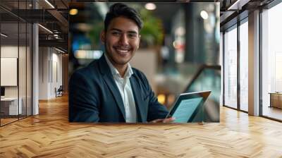 Young successful hispanic businessman at workplace using app on tablet computer, smiling man inside office building, working with laptop, wearing business suit, happy with achievement, Generative AI Wall mural