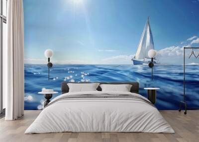 A sailboat on the open sea with a clear blue sky and sunlight in the background. white boat on blue sea Wall mural