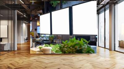 Restaurant counter with blank menu screens and fresh food display in a modern eatery. fresh salads and ingredients with clean, blank digital menus overhead.. Wall mural