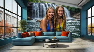 two women in the water at a waterfall on vacation Wall mural