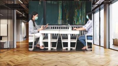 Asian Woman Working on Laptop while Wearing Medical Mask in Co Working Space - New Normal Lifestyle Social Distancing Wall mural