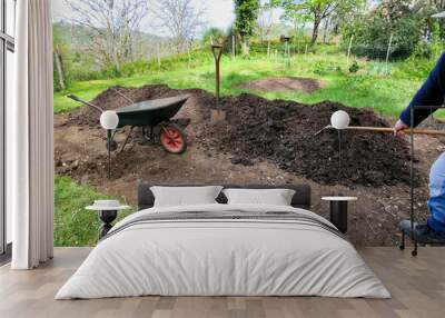 Compost being raked onto the vegetable bed
 Wall mural