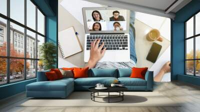 Asian business woman using computer to work from home via video conference with clients during covid-19 or coronavirus outbreak. technology and new normal concept Wall mural