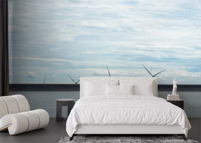 landscape of wind turbine for generate renewable electricity and the dam under blue sky Wall mural