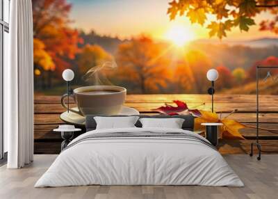 A cozy cup of coffee on a wooden table during a fall sunrise Wall mural