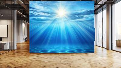 Blue abstract water background with sunbeams shining through, creating a serene and natural scene Wall mural