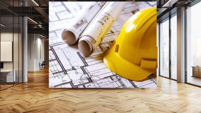 Architectural plans and yellow hard hat on blueprints background. Wall mural