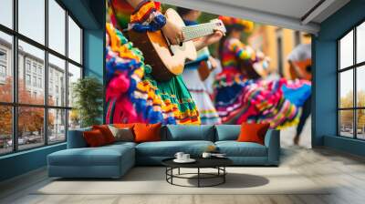 Mexican traditional dance and music performance in colorful costumes, closeup of guitar players during fiesta parade on street background. Wall mural