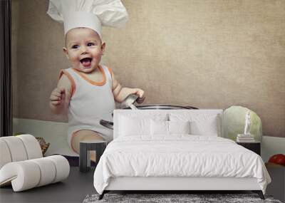 little baby in a chef's hat and ladle in hand Wall mural