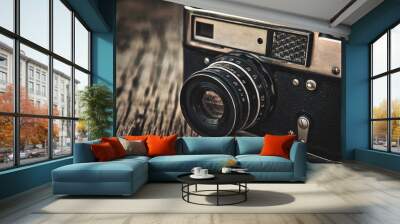 old vintage camera closeup on wooden background Wall mural