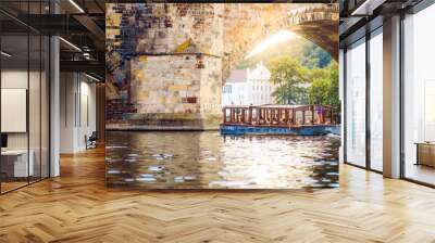 Prague, Bohemia, Czech Republic. Sunset aerial view of the old tour boat and bridge under vltava river in Praha. Wall mural