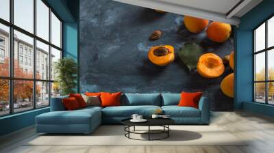 Ripe juicy orange apricots on a blue concrete background, view from above. Copy space. Wall mural