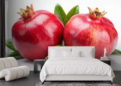 Two Vibrant Pomegranates with Lush Green Leaves Displaying the Juicy Ripe Fruit's Rich Red Hue Wall mural