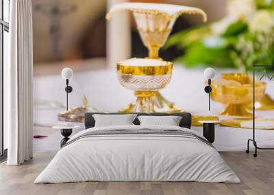 chalice with wine, blood of christ, and pyx with bread, body of christ, ready for the communion of the faithful Wall mural