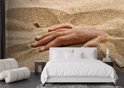 hand in rigor mortis on the beach Wall mural