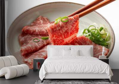 chopsticks holding raw beef sliced isolated on a transparent background Wall mural