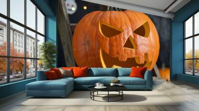 Halloween jack o lantern pumpkin placed on ladder. Wall mural