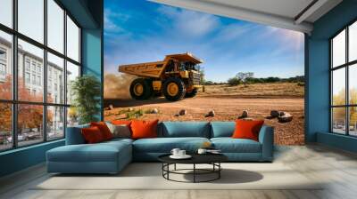 huge yellow mining truck on a dirt road Wall mural