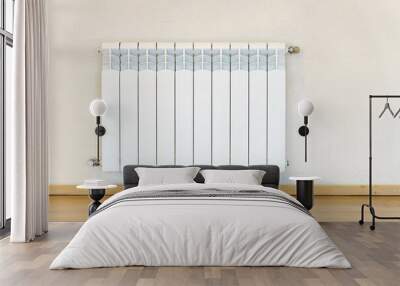 A new modern radiator on a white wall. Central heating system in a residential building. The concept of energy saving, consumption of natural resources and renewable eco-energy. Wall mural