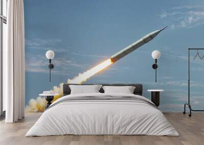 A large military ballistic rockets are take off in the blue sky. War concept Wall mural