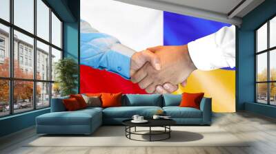 Business handshake on the background of two flags. Men handshake on the background of the Poland and Ukraine flag. Support concept Wall mural