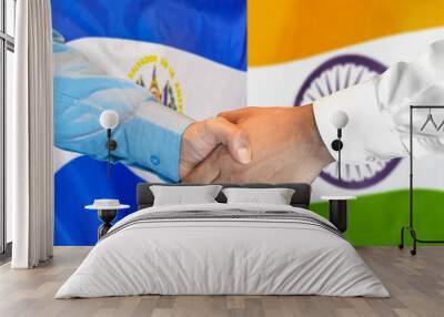 Handshake on El Salvador and India flag background. Support concept. Wall mural