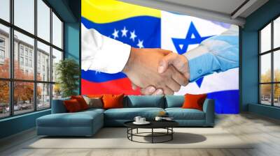 Handshake on Venezuela and Israel flag background. Wall mural