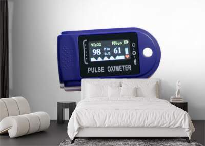 Close-up of a blue pulse oximeter showing 99% saturation - normal, isolated image Wall mural