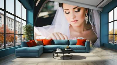 Beautiful bride in a car Wall mural