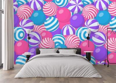 Seamless pattern with pile of striped balls, bubble gum, round candies or beach bouncy spheres. Vector cartoon background with many sweet dragee with spiral pattern, gumballs or plastic sport toys Wall mural