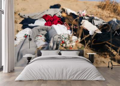 Desert Full of Used clothes and textile dump Wall mural