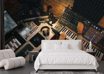 Dj producer is mixing a new music track Wall mural