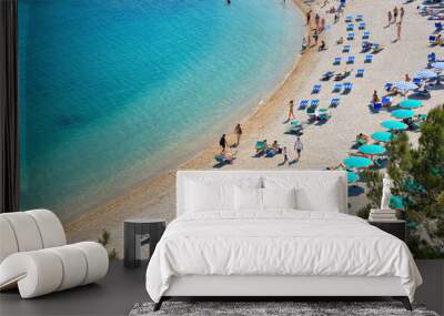 seascape, paradise beach with people, umbrellas and natural summer landscape view from Sirolo Marche, Italy Wall mural