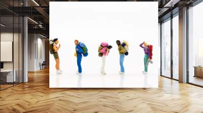 Miniature people: Travelers standing on white background , Image use for travel concept. Wall mural