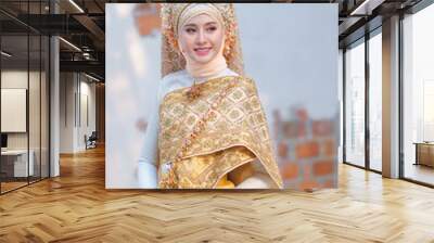 Beautiful bride in traditional Muslim wedding dress applied with luxurious Thai clothing combined blend of two cultures in the Lanna style, Chiang Mai, Thailand. Wall mural