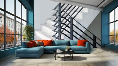 Stairway with black metallic banister in a new modern building architecture Wall mural