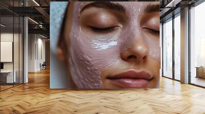 Close-up of a Woman's Face with a Pink Facial Mask, Emphasizing the Textured and Glowing Skin Wall mural