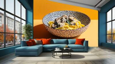 Creamy Mushroom Fettuccine Pasta in a Decorative Bowl on a Colorful Background Wall mural