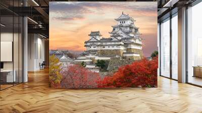 Himeji Castle and red maple leaves in evening sunlight and twilight sky in Himeji city, Hyogo prefecture of Japan. Wall mural