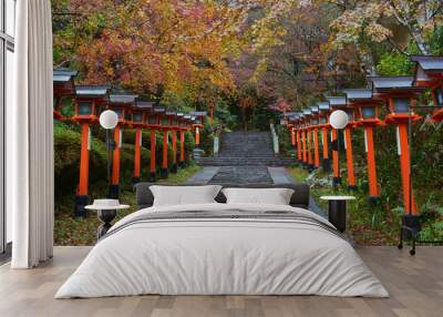 Traditional lamp posts beside the stairs in the Kurama Dera Temple, Kyoto, Japan. Wall mural