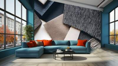 A close-up shot of different textures and materials, such as fabric swatches, paper samples, and metal objects, set against a neutral background for depth Wall mural