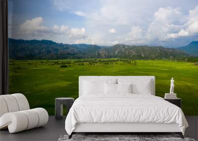 Arial view of rock mountain in with cloudy sky Wall mural