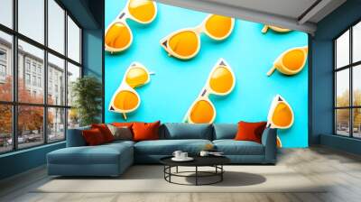 White Sunglasses with Orange Lenses on a Turquoise Background Wall mural