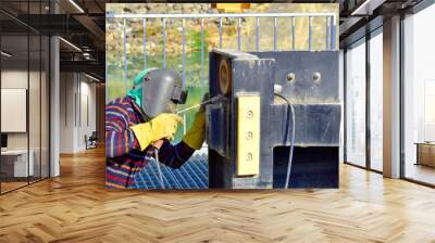 The welder working to welding the bushing of stoplock sluice the dam,December 2019 Wall mural